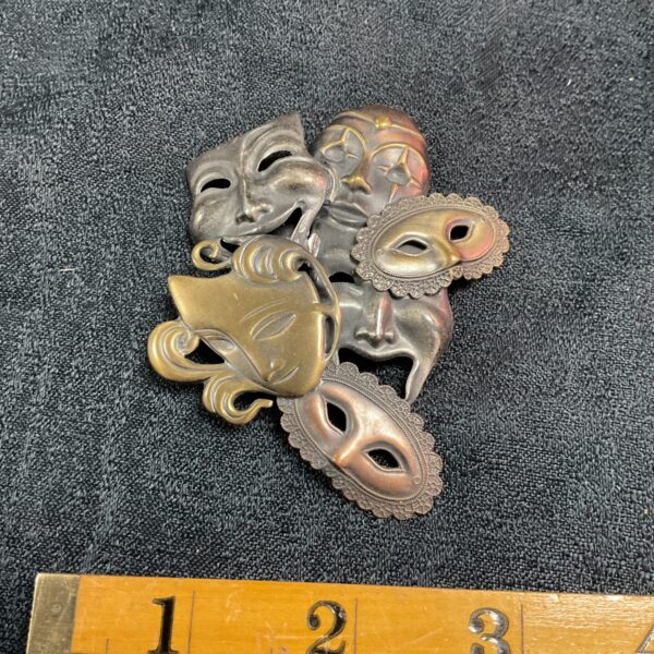 Vintage K&T brooch with multiple drama and masquerade masks.