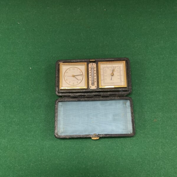 Vintage LSM travel alarm clock weather station open.