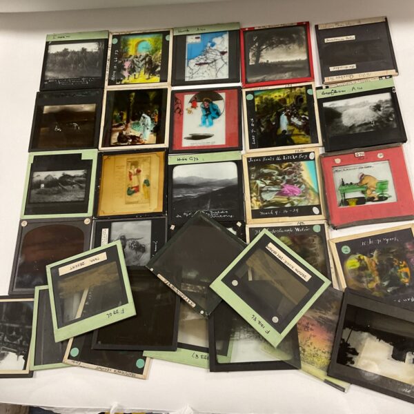 Collection of vintage magic lantern glass slides for collectors.