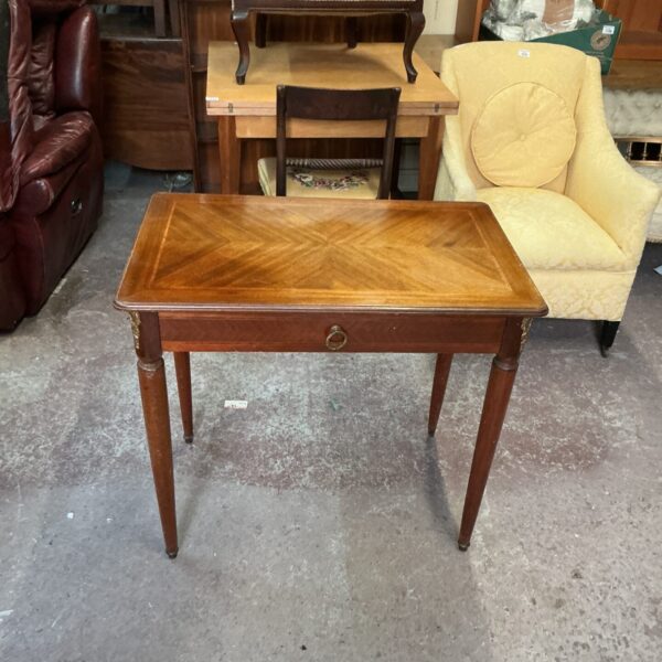 Elegant vintage mahogany hall table with inlaid design.