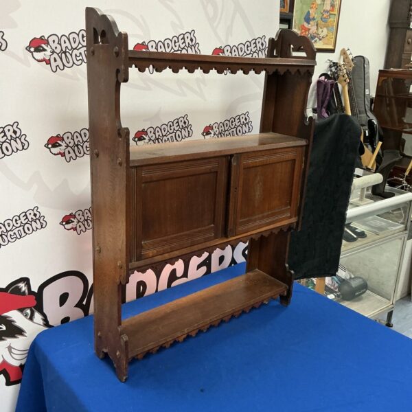 Vintage mahogany wall cabinet with glass door for display.