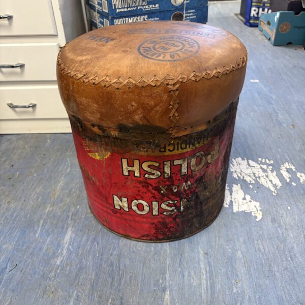 Vintage Mansion Wax seat with leather top and worn label.