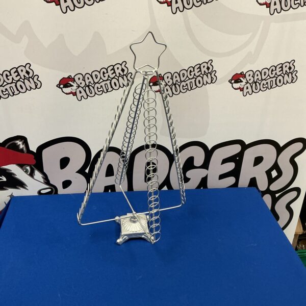 Vintage metal Christmas tree for holiday display.