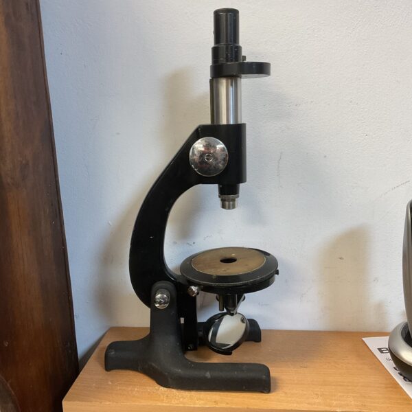 Brass vintage microscope, antique scientific instrument for collectors.