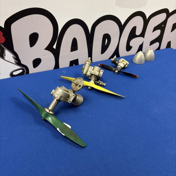 Vintage model aeroplane engines and aluminium spinners for collectors.