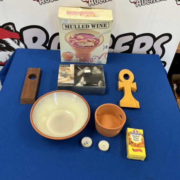 Vintage mulled wine kit with pewter napkin rings for festive drinks.