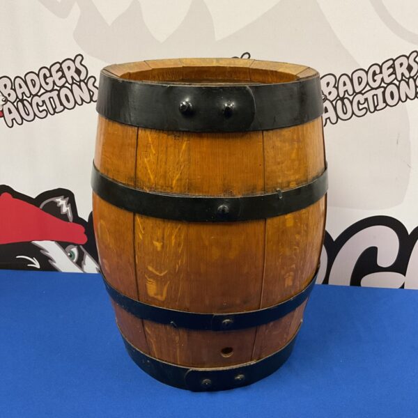Vintage oak barrel with iron banding for rustic decor.