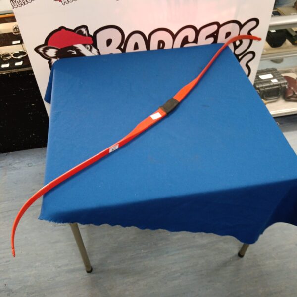 Vibrant orange vintage longbow displayed on a blue surface.