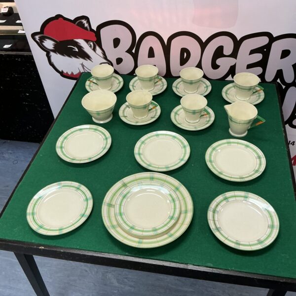 Vintage Palissy coffee set with floral design on a green background.