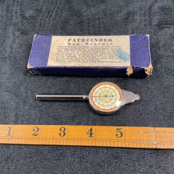 Vintage Pathfinder map measure for calculating map distances.