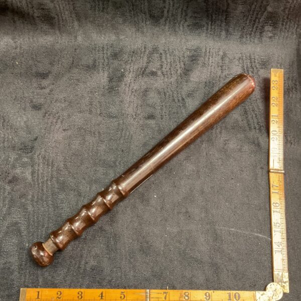 Vintage police truncheon by Hatt & Co, side view.