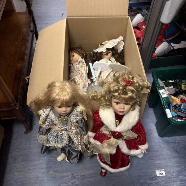 Vintage porcelain dolls from the Leonardo Collection in a box.