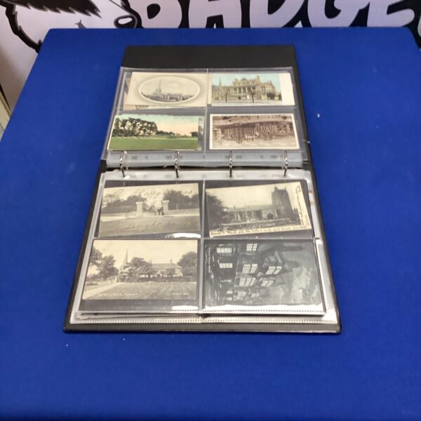 Vintage postcard album filled with antique and collectible postcards.