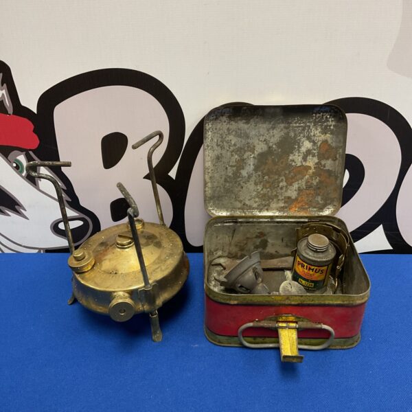 Vintage Primus stove in original red tin with accessories.