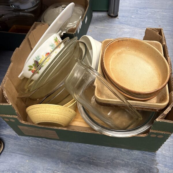 Vintage Pyrex kitchenware lot with various bowls and dishes.