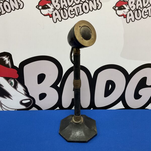 Vintage 1940s radio broadcast microphone with weighted base.