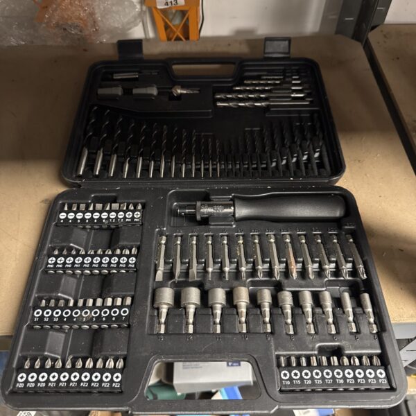 Vintage ratchet screwdriver set with interchangeable bits for various tasks.