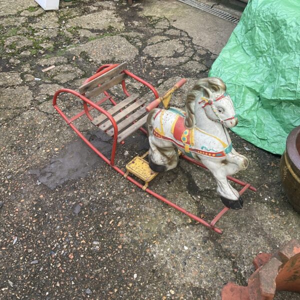 Painted vintage rocking horse, a classic children’s toy.