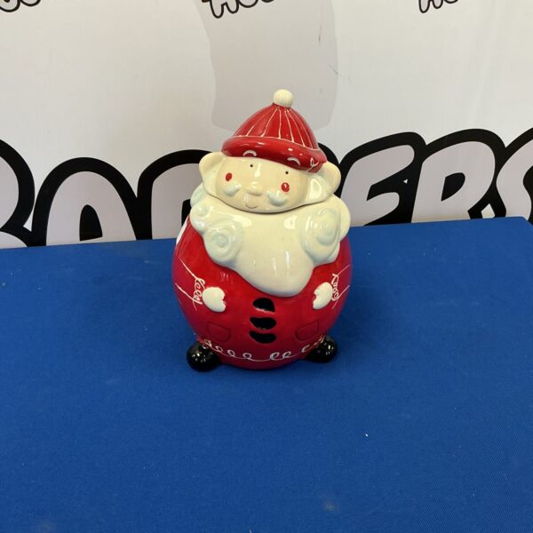 Vintage ceramic Santa cookie jar for Christmas kitchen decor.