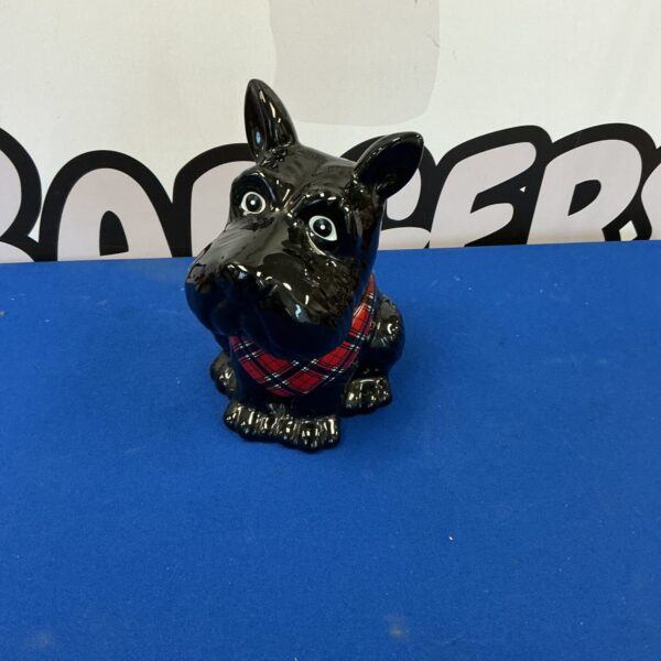Vintage ceramic Scottie dog cookie jar for kitchen storage.