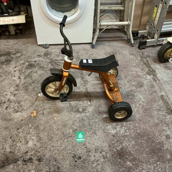 Vintage Scrambla trike, a classic child’s tricycle in bright colour.