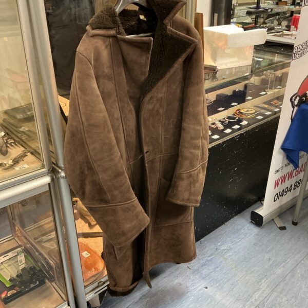 Long vintage sheepskin coat with leather detailing.