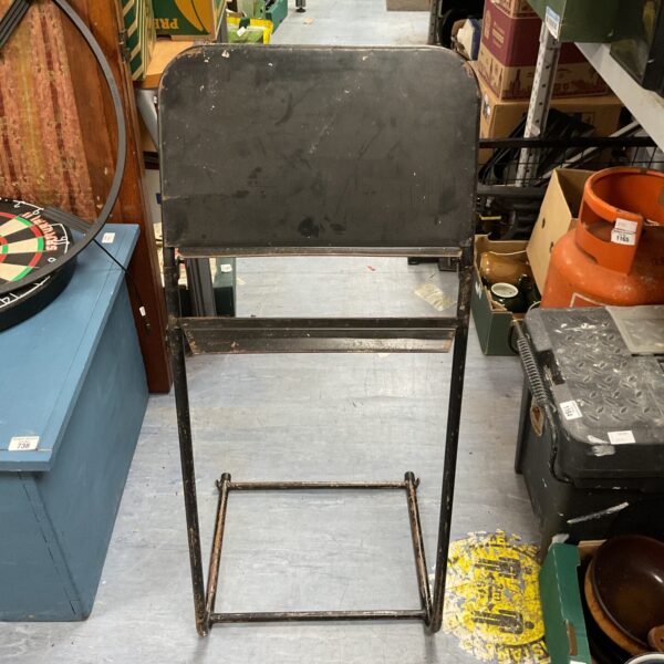 Vintage metal sheet music stand with adjustable holder.
