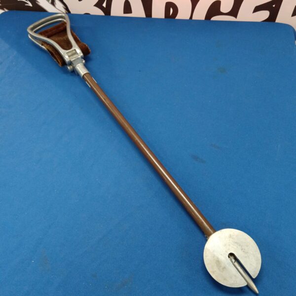 Vintage shooting stick with a distinctive seat for game shooting.