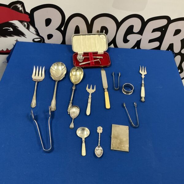 Vintage silverplate tableware selection with sugar tongs.