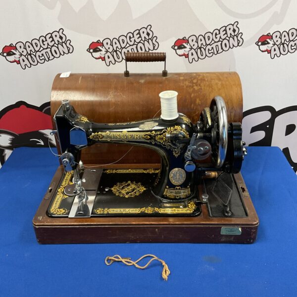 Vintage Singer sewing machine in its original case.