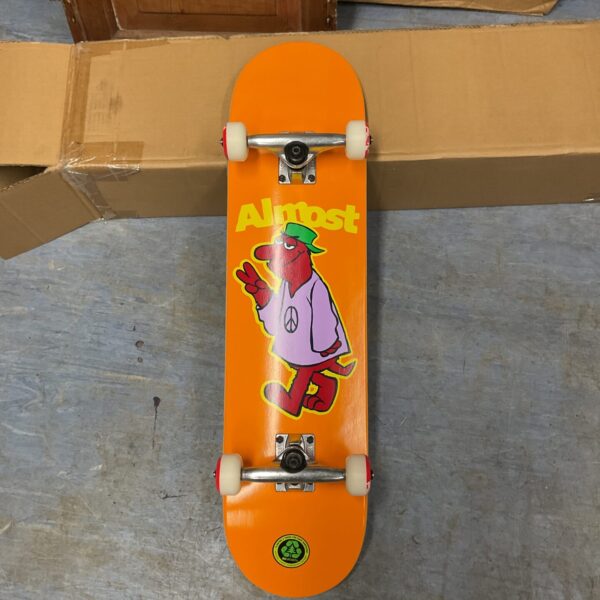 Vintage skateboard with colourful character graphic.