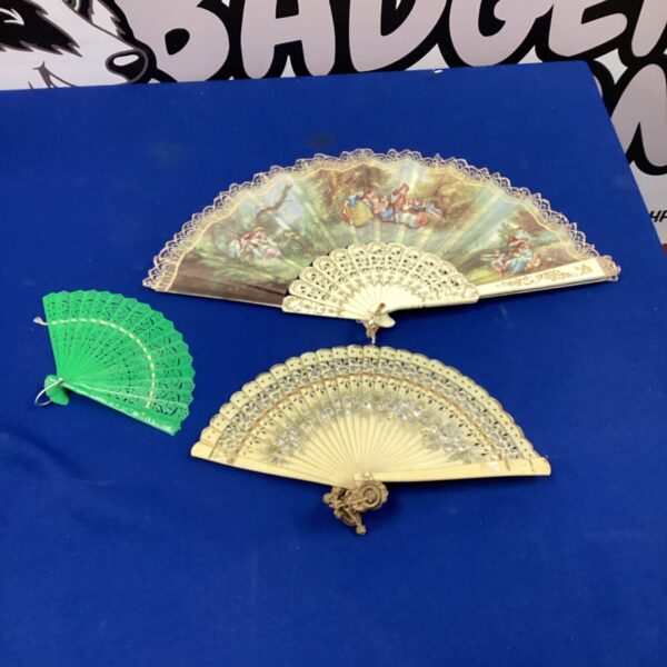 Lot of three vintage Spanish fans with floral designs.