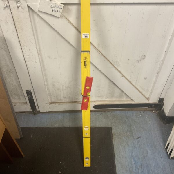 Vintage wooden spirit level for accurate measurement.