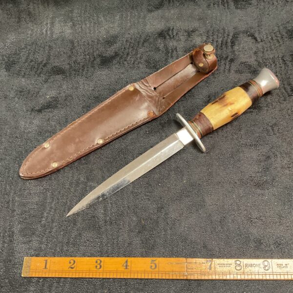 Vintage William Rogers stiletto knife with leather sheath.