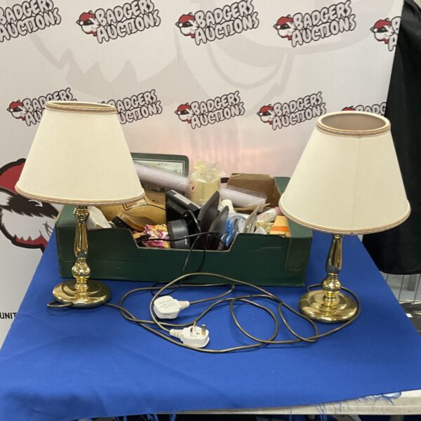 Two vintage brass table lamps with a box of items.
