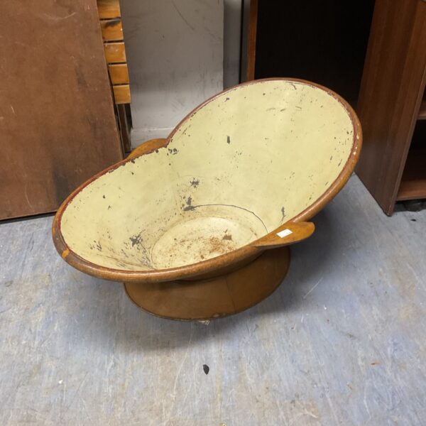 Vintage tin bath with worn paint, ideal for farmhouse decor.