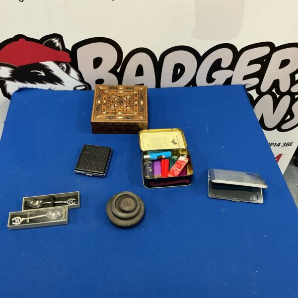 Mixed lot of vintage tins with decorative designs.