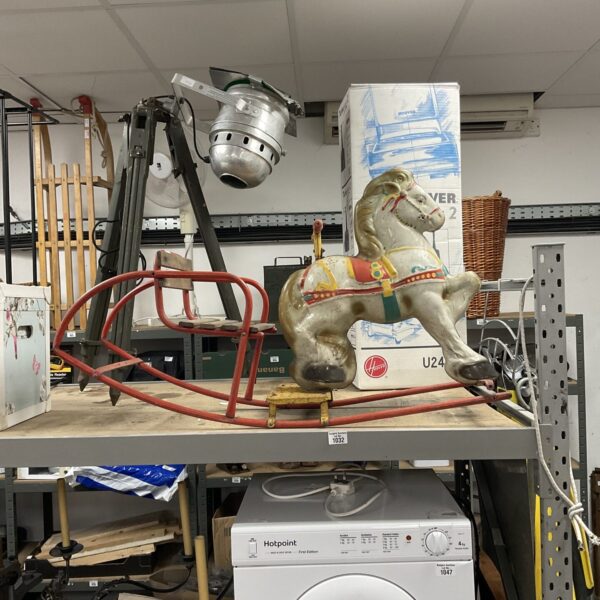 Vintage tin plate rocking horse, a classic collectible toy.