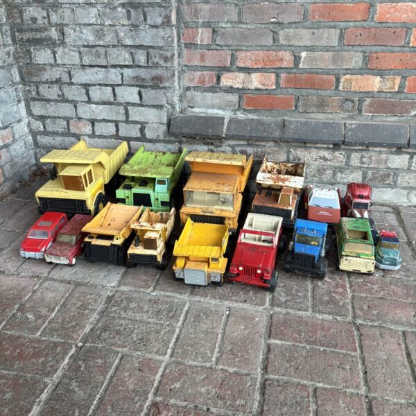 Vintage Tonka trucks lot, collectible metal toy vehicles.