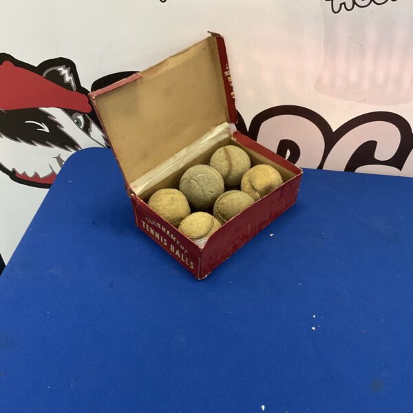 Vintage tournament tennis balls in original cardboard sleeve.
