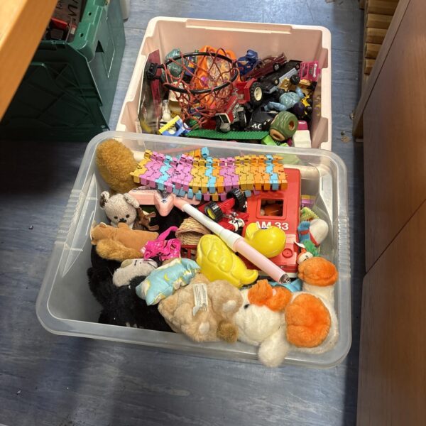 Overview of a vintage toy lot with mixed retro toys.