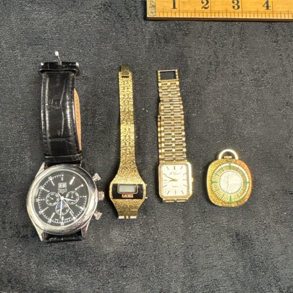 Vintage Trias watch with black dial and leather strap.