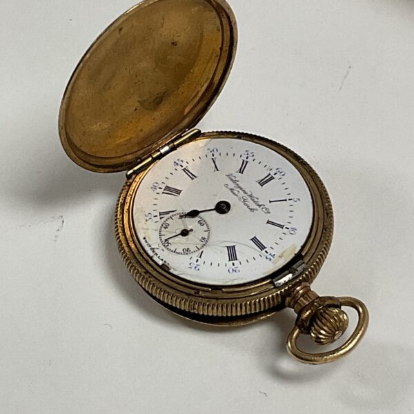 Open vintage Valengine watch showing the dial and hands.