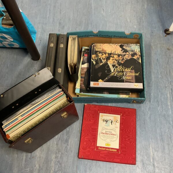 Vintage suitcase filled with a diverse vinyl record lot.