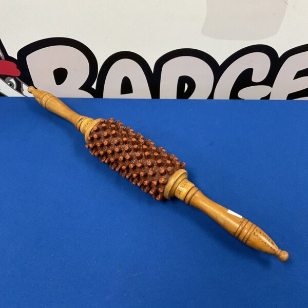 Vintage Wilma Le Vampire massage roller with wooden spheres.