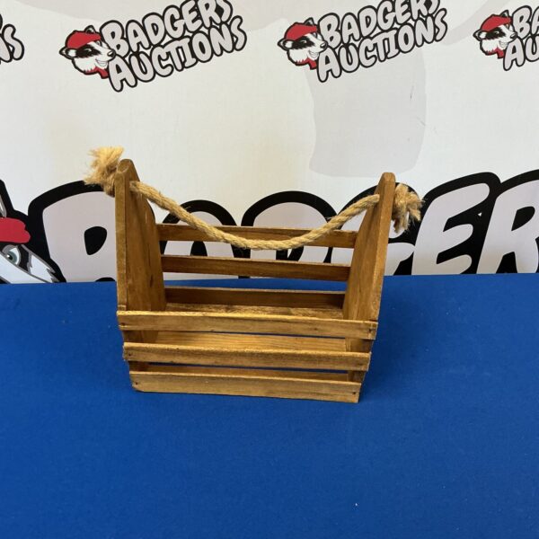 Vintage wooden milk bottle carrier with handle for farmhouse style.