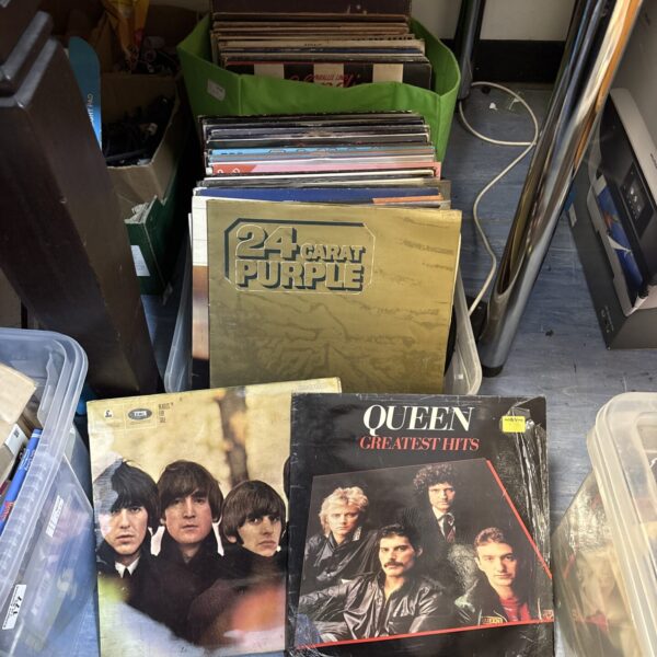Mixed vinyl record collection featuring Beatles, Queen and Blondie albums.