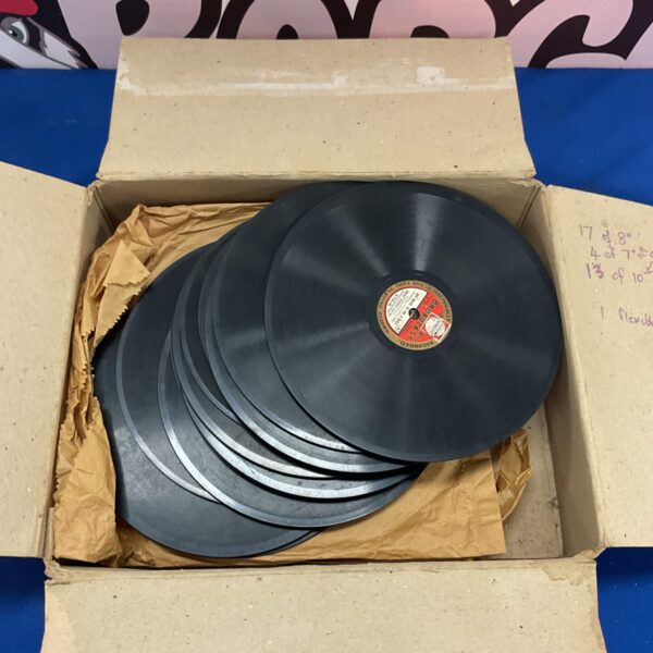 Box of vintage 7 inch vinyl records for collectors.