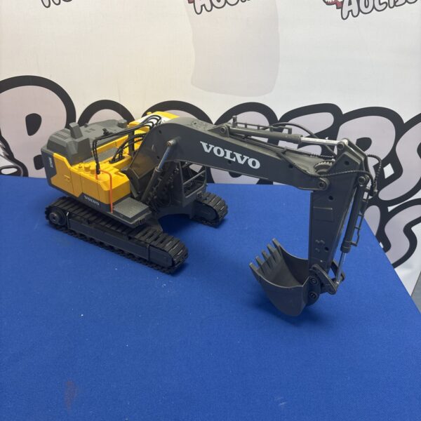 Yellow Volvo excavator toy for children, construction vehicle.