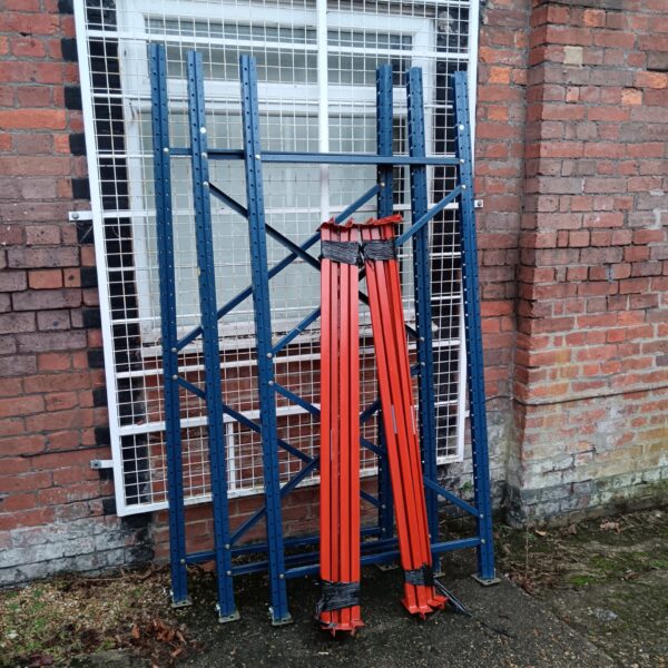 Heavy duty metal warehouse racking for industrial storage.